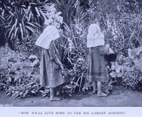 Now we'll give some to the big garden borders, 1908. Two girls watering plants. Gertrude Jekyll was
