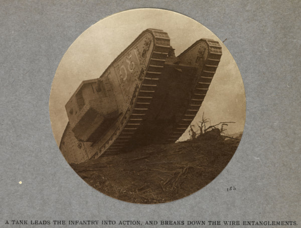 A tank leads the infantry into action and breaks down the wire entanglements. 1915 (1921). From