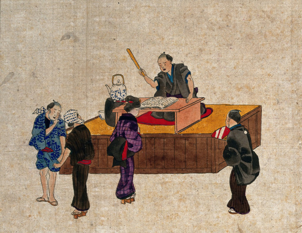 A man sits at a table on a platform reciting from a book, while three..., (between 1800 and 1899?). Creator: Unknown.