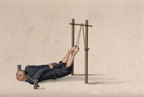 A Chinese man confined to a contraption which ties his legs on to a wooden gallows whilst... Creator: Unknown.