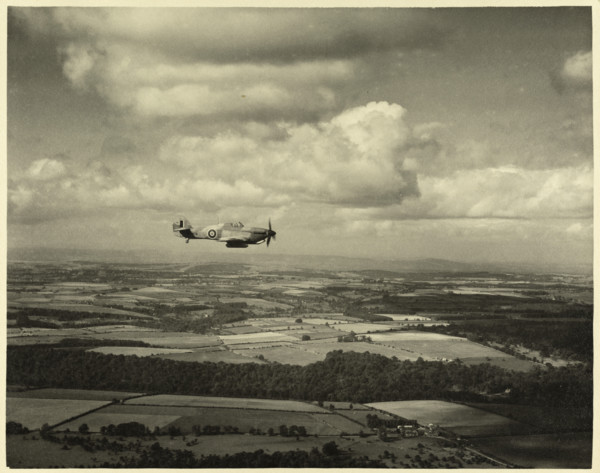 RAF Film Production Unit film still showing a 'hurribomber' in flight, 1942. Creator: Royal Air Force Fim Production Unit.