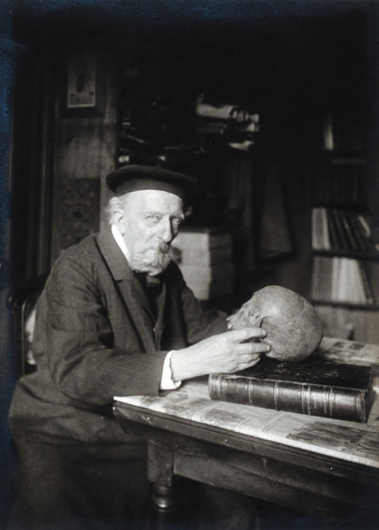 Adrien de Mortillet, holding a skull. Creator: Unknown.