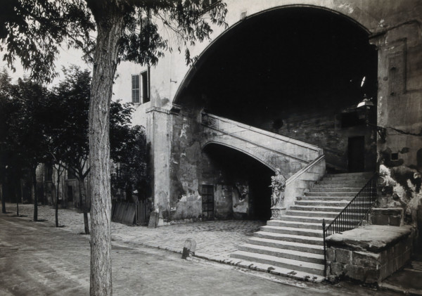 Hospital de la Santa Cruz, Barcelona: a staircase leading up to the men's department... Creator: Unknown.