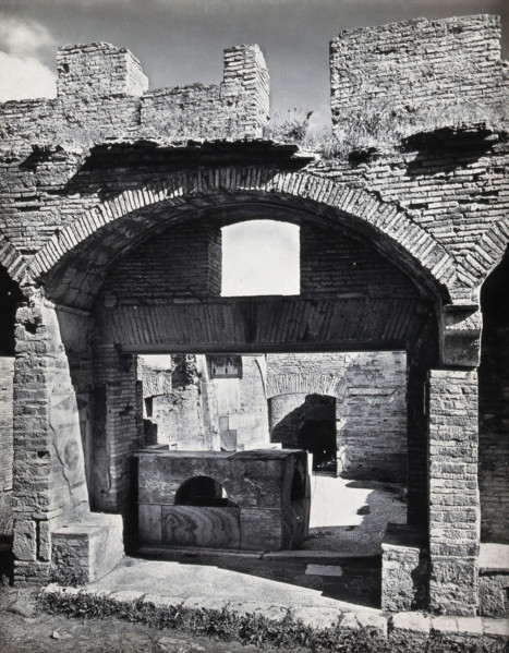 Partly ruined buildings in Ostia identified as a tavern or hot-food shop (thermopolium)..., 1920-9. Creator: Domenico Anderson.