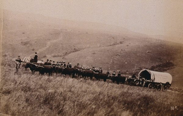 South Africa: landscape with people, a wagon and oxen in the foreground, 1896. Creator: Unknown.