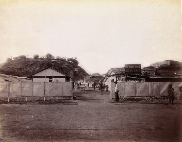 A plague patient being transported on a manually propelled ambulance carriage...,  1896/1897. Creator: Unknown.