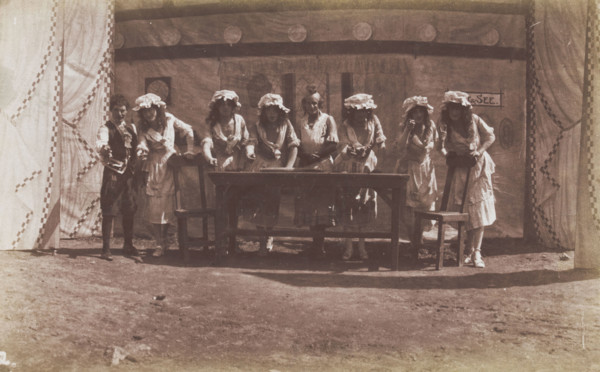 British servicemen in drag acting out a cooking class, 1918. Creator: Unknown.