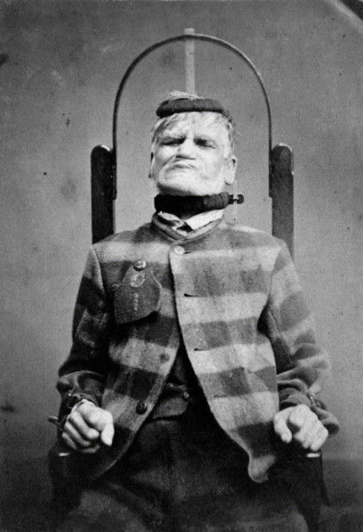 Wakefield Prison, Yorkshire: an elderly man, struggling against the restraint-chair in..., c1869. Creator: Unknown.