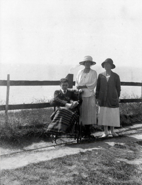 A physically disabled boy sitting in a wheelchair,  c1910/1925. Creator: Unknown.