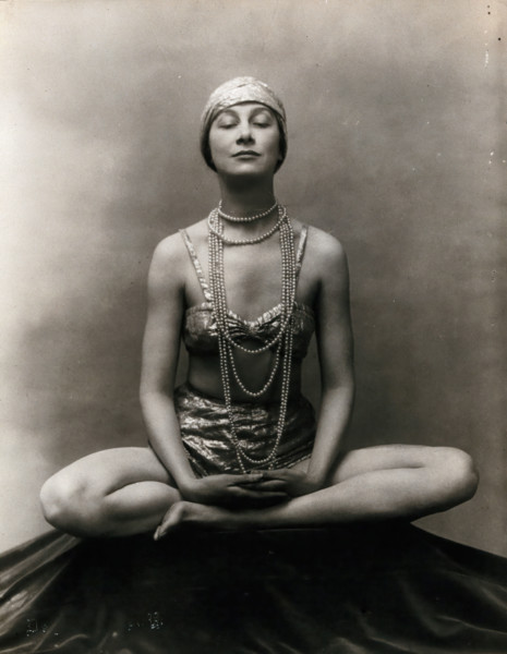 Marguerite Agniel posing with her legs crossed and hands together resting on her legs, 1929. Creator: Unknown.