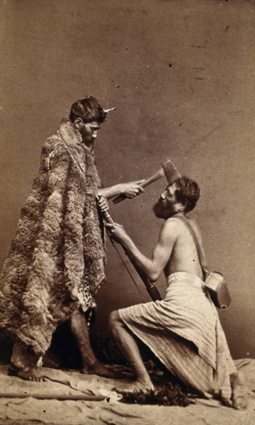 Two Maori men, simulating armed attack with a hatchet and a spear(?), c1880s. Creator: Unknown.