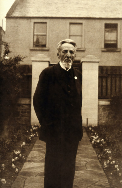 An unidentified man, standing in a garden, c1900. Creator: Unknown.
