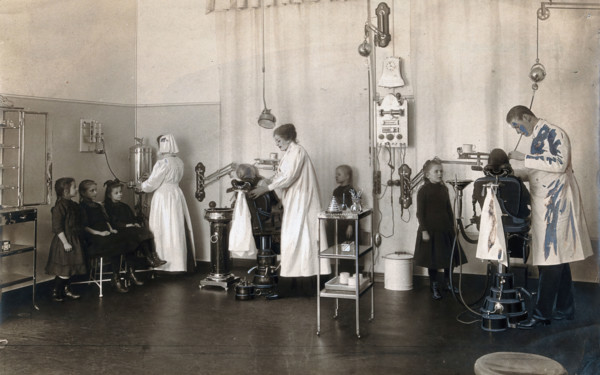 A school-children's dental clinic in Berlin: some children being treated..., c1900. Creator: Unknown.