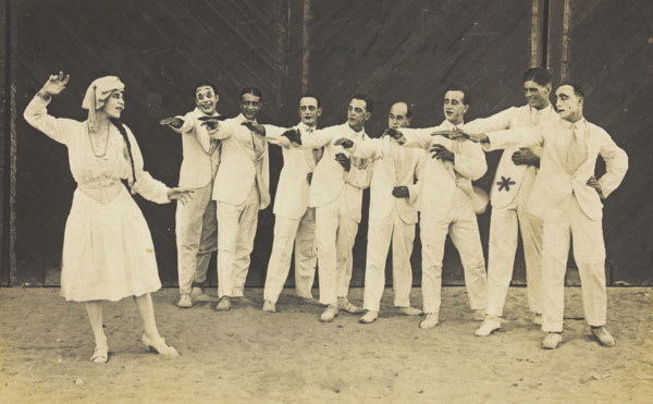 Actors, one in drag, performing on stage as "The Curios",  c1918-1920. Creator: Unknown.
