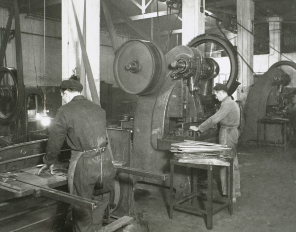 Production line of a company who manufacture motorcycle components, Barcelona, Spain, 1945.  Creator: Unknown.