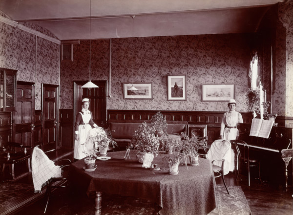 Claybury Asylum, Woodford, Essex: a social room (?) , [1893?]. Creator: London & County Photographic Co.