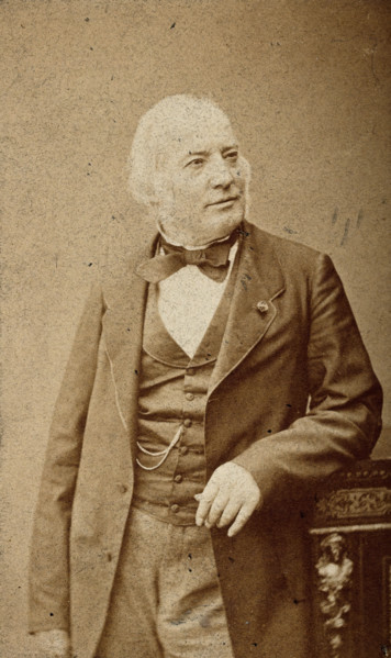 An unidentified man leaning on a cabinet, c1880s. Creator: Frederick Mulnier.