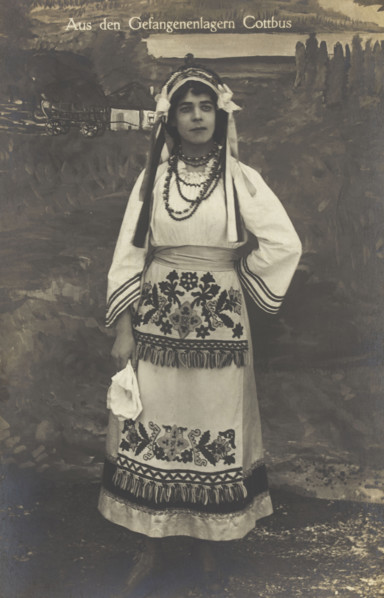 A Ukrainian prisoner of war performing a dance at a prisoner... (between 1910 and 1919?). Creator: Paul Tharan.