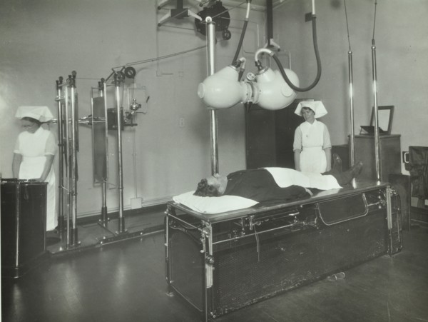 A patient undergoes a medical procedure, c1950s. Creator: Unknown.