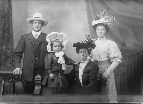 Portrait of unknown family, 1906. Creator: Robert Augustus Henry L'Estrange.