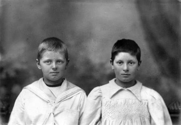 Portrait of two unknown siblings (brother and sister), c1900s. Creator: Robert Augustus Henry L'Estrange.
