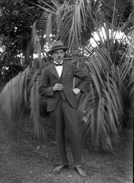 Photos and life story of John Henderson L'Estrange (1864-1913) standing and William Manderville Elli Creator: Robert Augustus Henry L'Estrange.