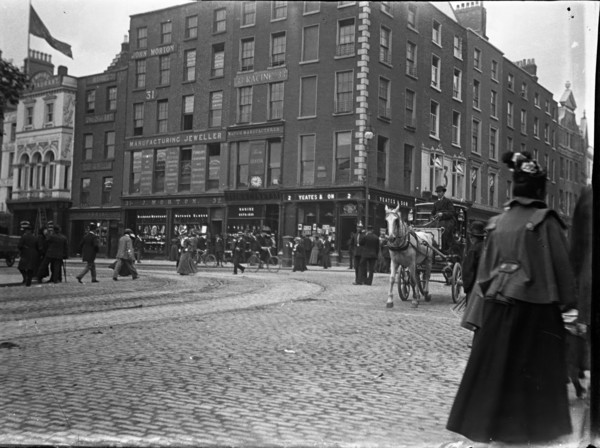 Racine Watch and clock makers building established 1833 (Ireland), 1895. Creator: Robert Augustus Henry L'Estrange.