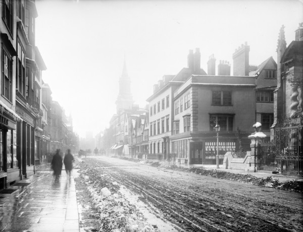A view down the High Street with snow and slush in the road, Oxford, Oxfordshire, 1885. Creator: Henry Taunt.