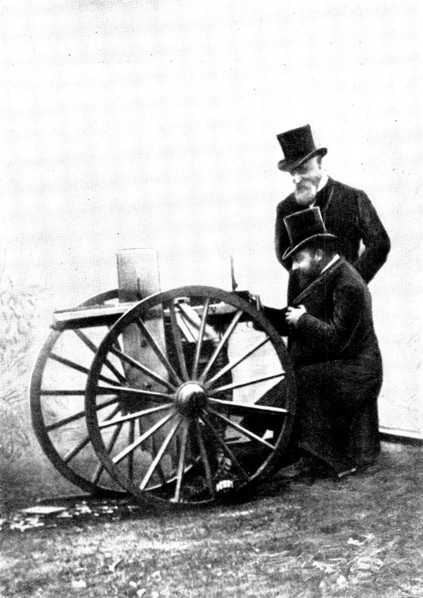 The Prince of Wales firing a Maxim Gun: Mr. Maxim standing by, 1898. Creator: Russell & Sons.