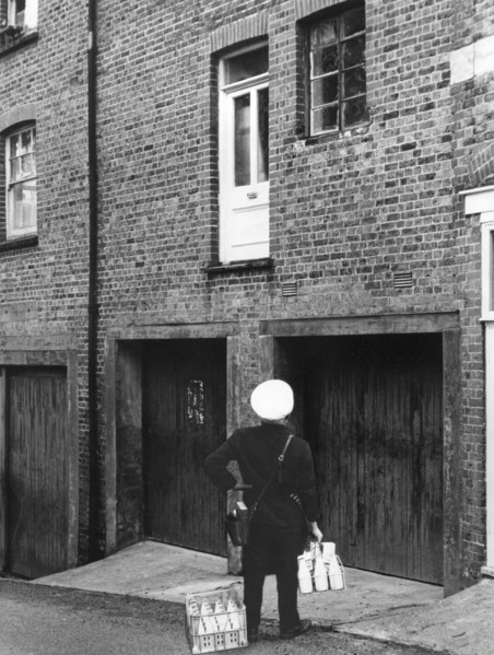 Confused milkman confronted with a doorstep on the first floor, c1955. Creator: Arthur Charles Kirby Ware.