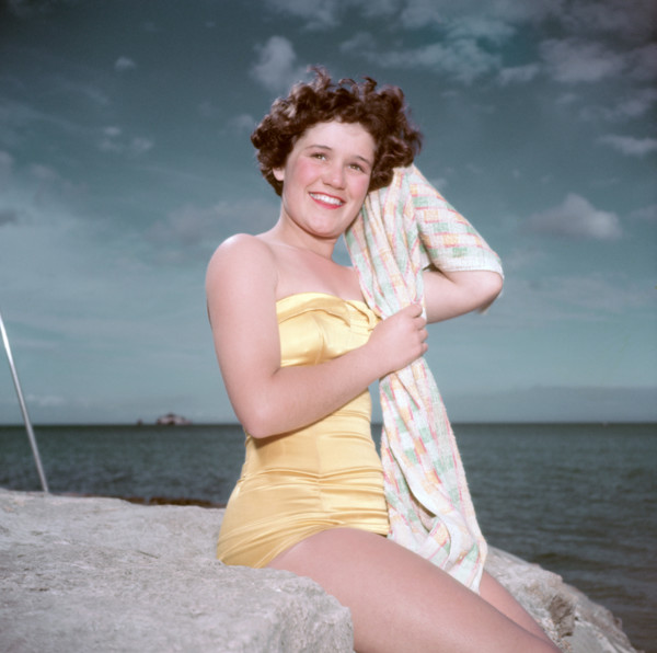 Portrait of a young woman in a swimsuit by the sea, c1955. Creator: Arthur Charles Kirby Ware.