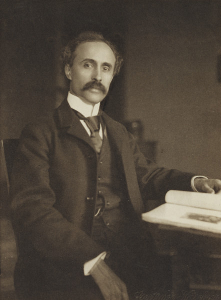 Man seated with table and book, 1896-1898. Creator: Gertrude Kasebier.