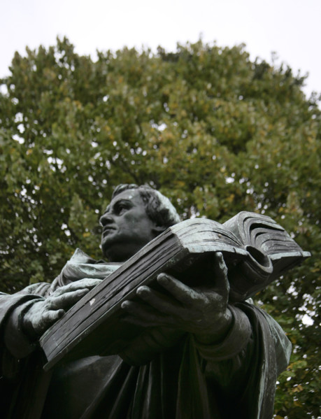 Bronze statue of Martin Luther next to the Marienkirche, (St Mary's Church), Berlin, Germany, 2025.  Creator: LTL.