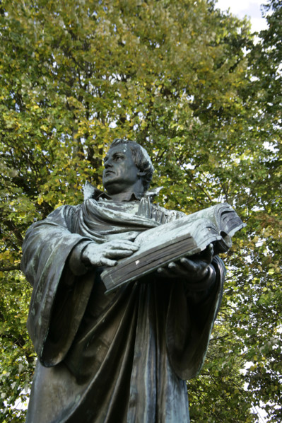 Bronze statue of Martin Luther next to the Marienkirche, (St Mary's Church), Berlin, Germany, 2025.  Creator: LTL.