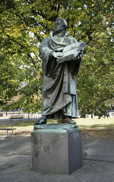 Bronze statue of Martin Luther next to the Marienkirche, (St Mary's Church), Berlin, Germany, 2025.  Creator: LTL.