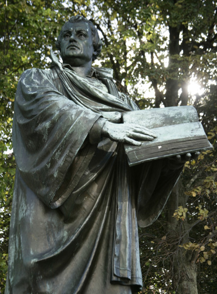 Bronze statue of Martin Luther next to the Marienkirche, (St Mary's Church), Berlin, Germany, 2025. Creator: LTL.