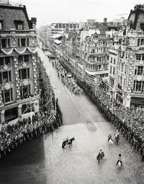 Crowds watching the coronation procession of Queen Elizabeth II, Oxford Circus, London, 2 June 1953. Creator: Arthur Charles Kirby Ware.