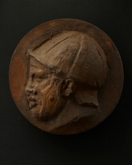 Cast of head of deceased or sleeping Roman auxiliary in helmet. Creator: Unknown.