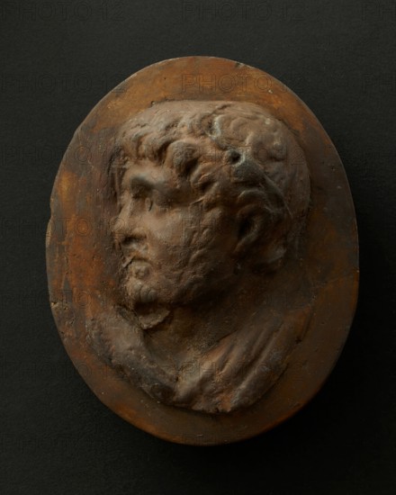 Cast of head of lightly-bearded man wearing wreath (?) and with mouth open. Creator: Unknown.