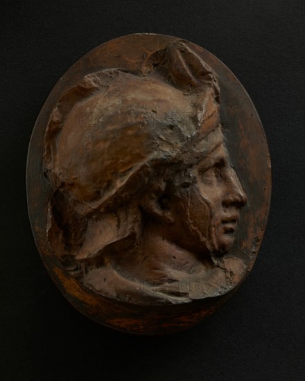 Cast of head of young auxiliary wearing a helmet. Creator: Unknown.