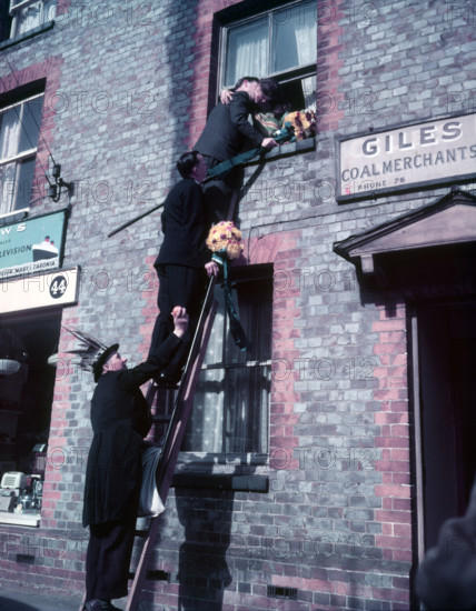 Tutti Men claiming a kiss, Hocktide Festival, Hungerford, Berkshire, c1955. Creator: Arthur Charles Kirby Ware.