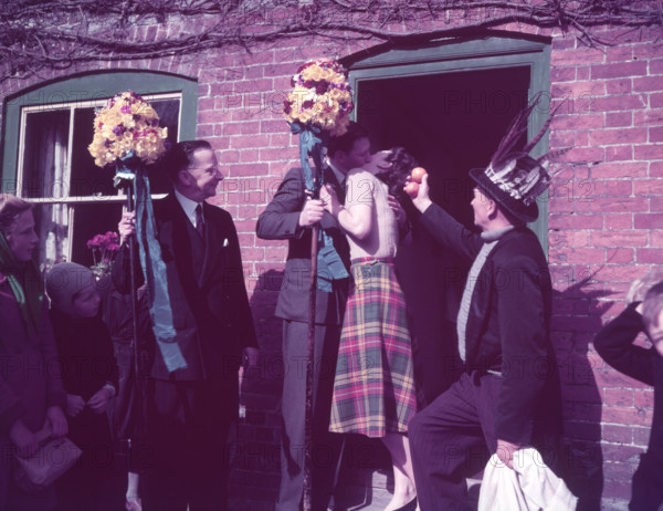 Tutti Men claiming a kiss, Hocktide Festival, Hungerford, Berkshire, c1955. Creator: Arthur Charles Kirby Ware.