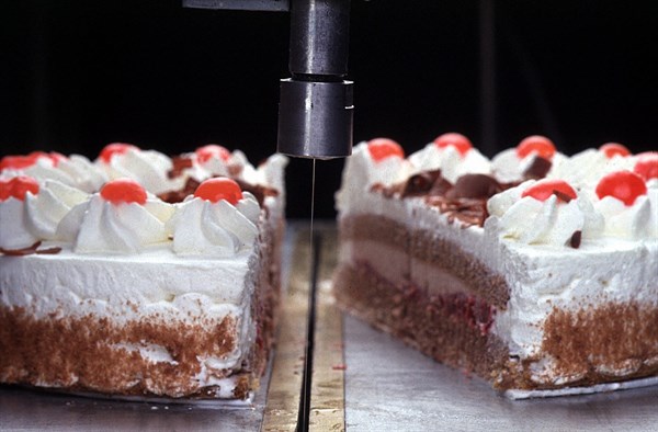 Water spray cutting a cake