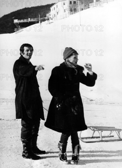 Ursula ANDRESS and Jean Paul BELMONDO with sleigh
