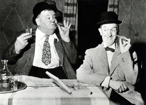Stan LAUREL and Oliver HARDY with cigars
