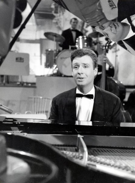 Peter ALEXANDER singing on the piano