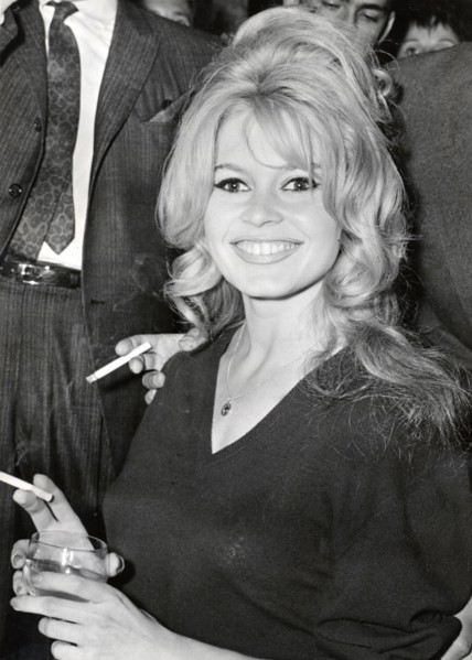 Brigitte BARDOT, portrait with cigarette and drinking glass