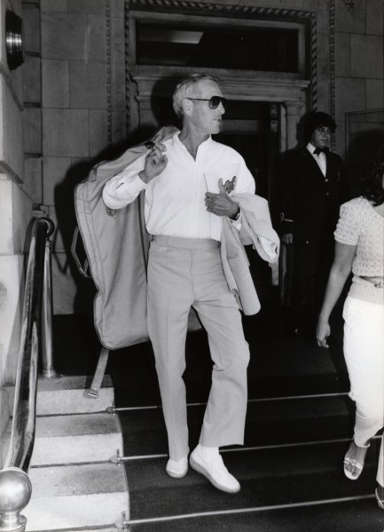 Paul NEWMAN with garment bag