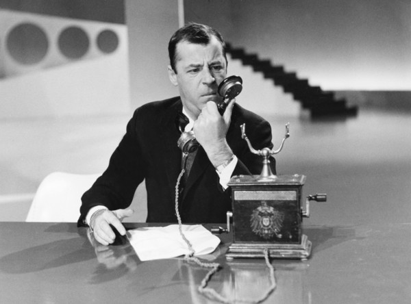 Chris HOWLAND with telephone during a television program