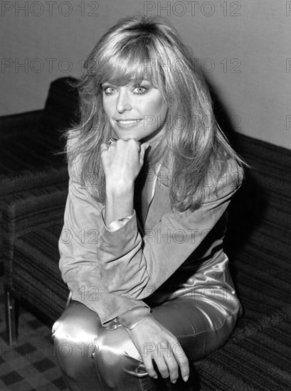 Farrah FAWCETT on a sofa